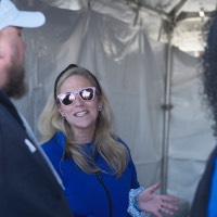 Woman with pink sunglasses talking